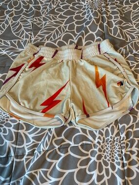 Aviator Nation Ivory Athletic Shorts with Red & Orange Lightning Bolts